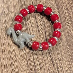 Red and Silver Beaded Bracelet with Dinosaur Charm